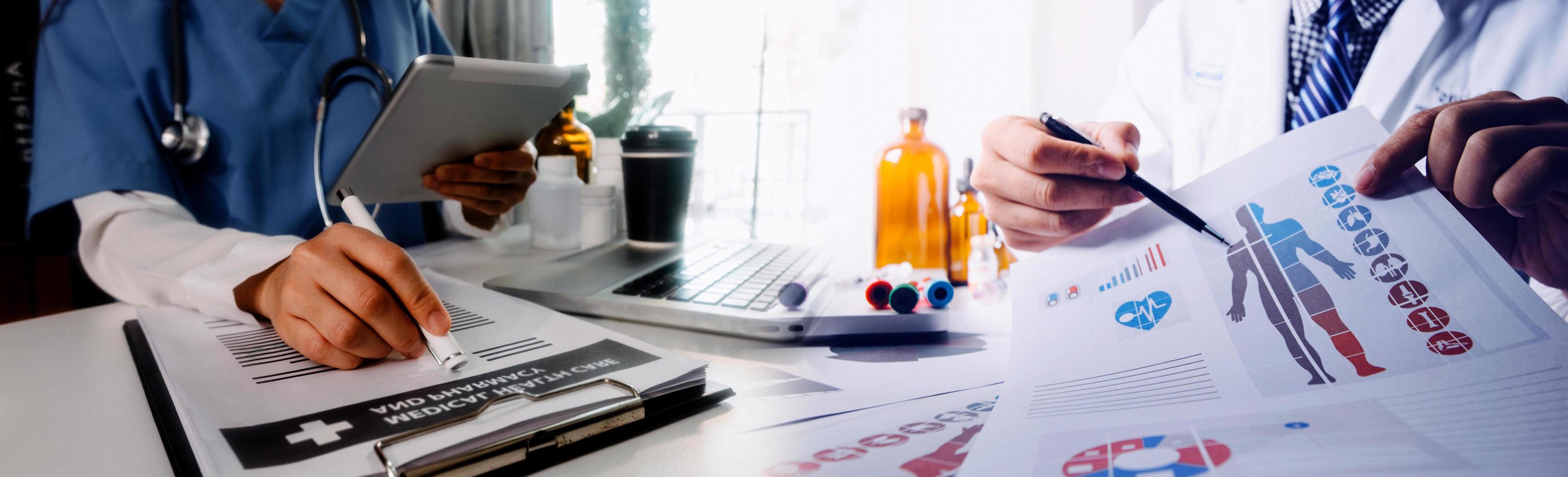 Medicine doctor hand working on a patients x-ray scans digital healthcare and connection with modern virtual screen interface icons, Medical technology and network concept. photo