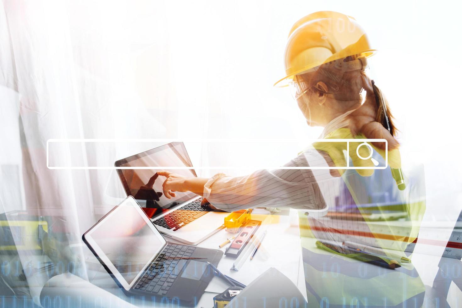 business hand working and laptop with on on architectural project at construction site at office desk in office photo