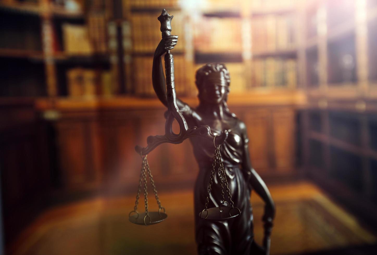 Business and lawyers discussing contract papers with brass scale on desk in office. Law, legal services, advice, justice and law concept picture with film grain effect photo