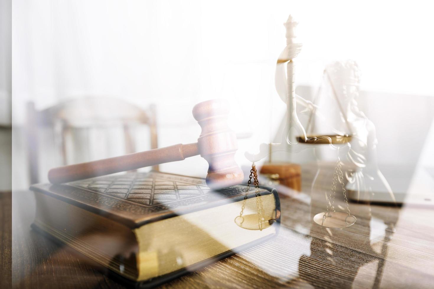 justice and law concept.Male judge in a courtroom on wooden table and Counselor or Male lawyer working in office. Legal law, advice and justice concept. photo