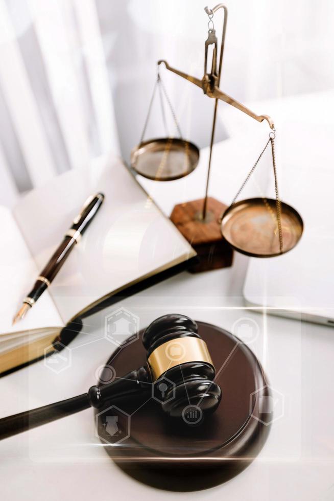 Business and lawyers discussing contract papers with brass scale on desk in office. Law, legal services, advice, justice and law concept picture with film grain effect photo