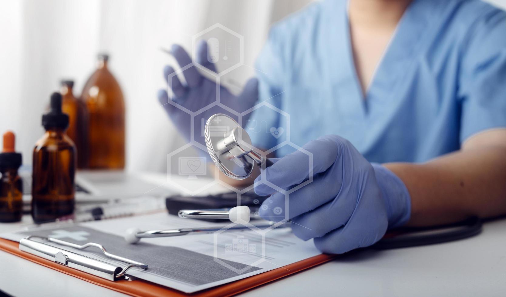 Medicine doctor hand working on a patients x-ray scans digital healthcare and connection with modern virtual screen interface icons, Medical technology and network concept. photo