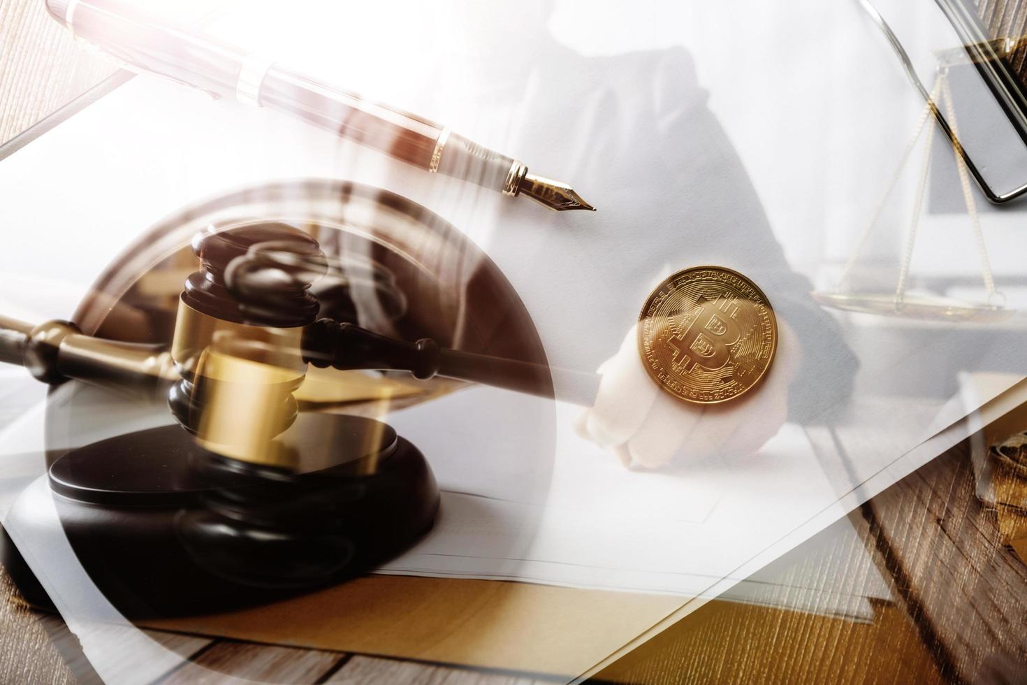 Business and lawyers discussing contract papers with brass scale on desk in office. Law, legal services, advice, justice and law concept picture with film grain effect photo