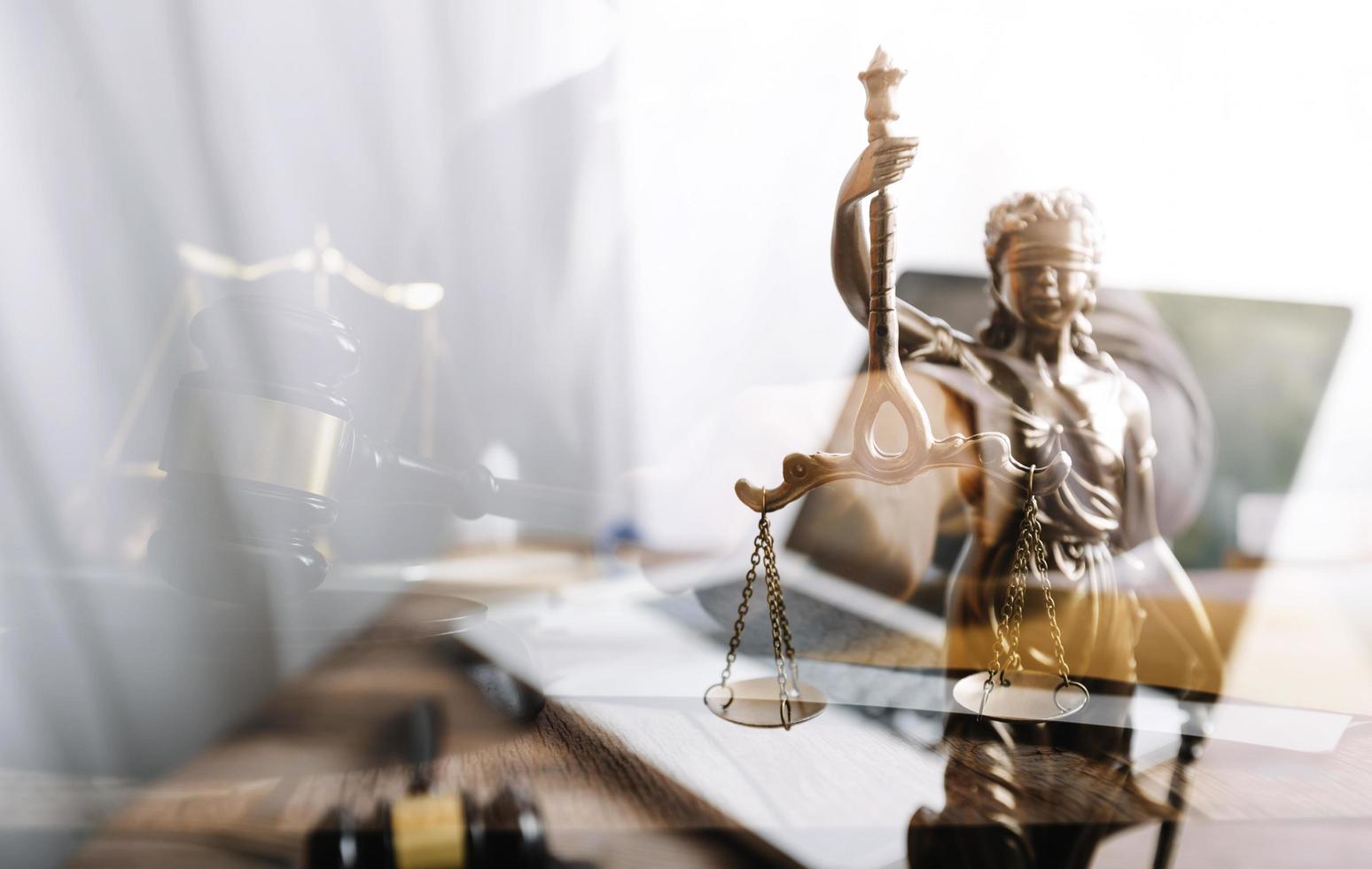 Business and lawyers discussing contract papers with brass scale on desk in office. Law, legal services, advice, justice and law concept picture with film grain effect photo