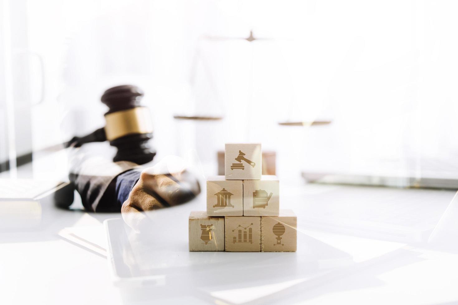 Business and lawyers discussing contract papers with brass scale on desk in office. Law, legal services, advice, justice and law concept picture with film grain effect photo