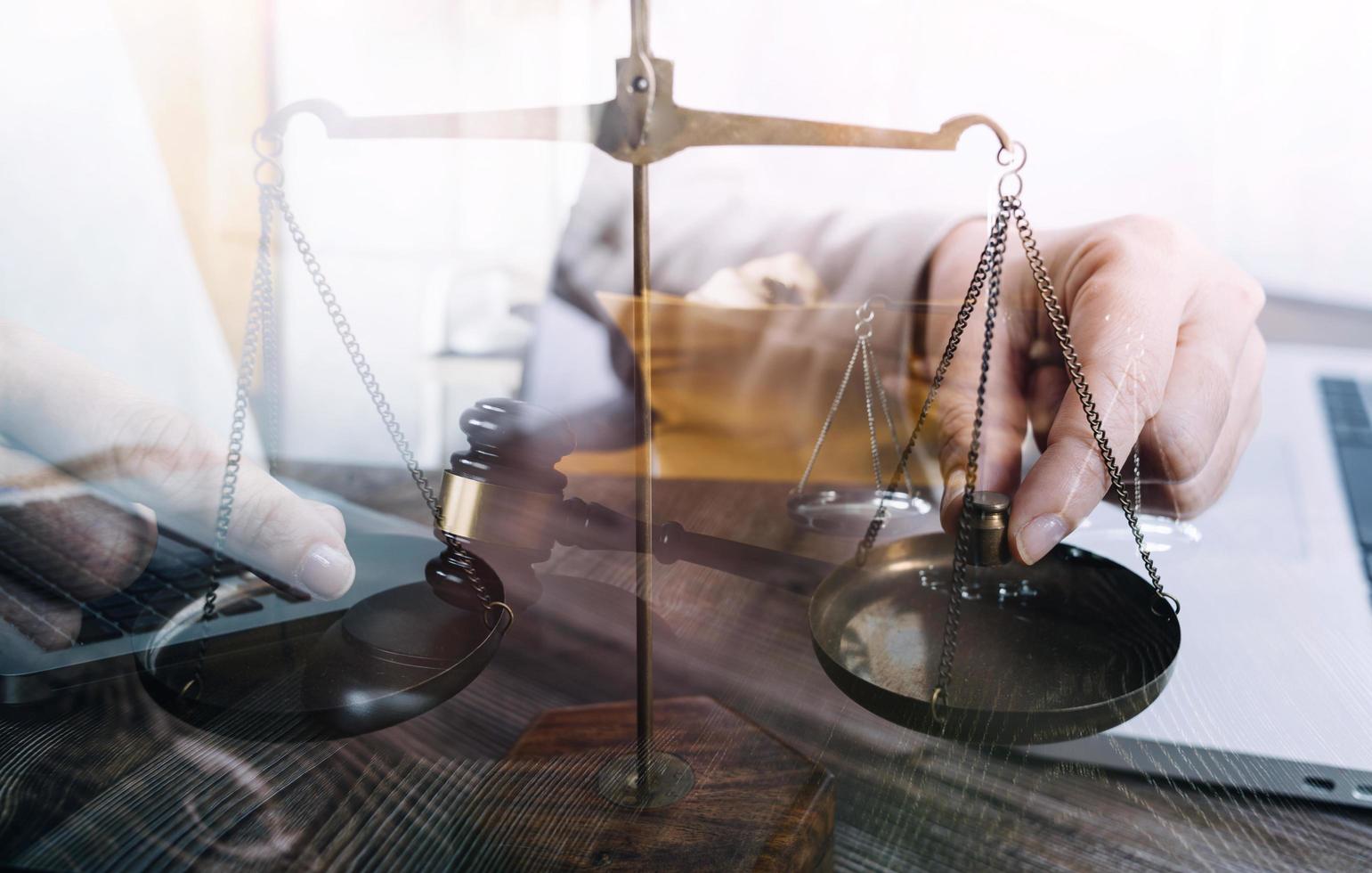 Business and lawyers discussing contract papers with brass scale on desk in office. Law, legal services, advice, justice and law concept picture with film grain effect photo