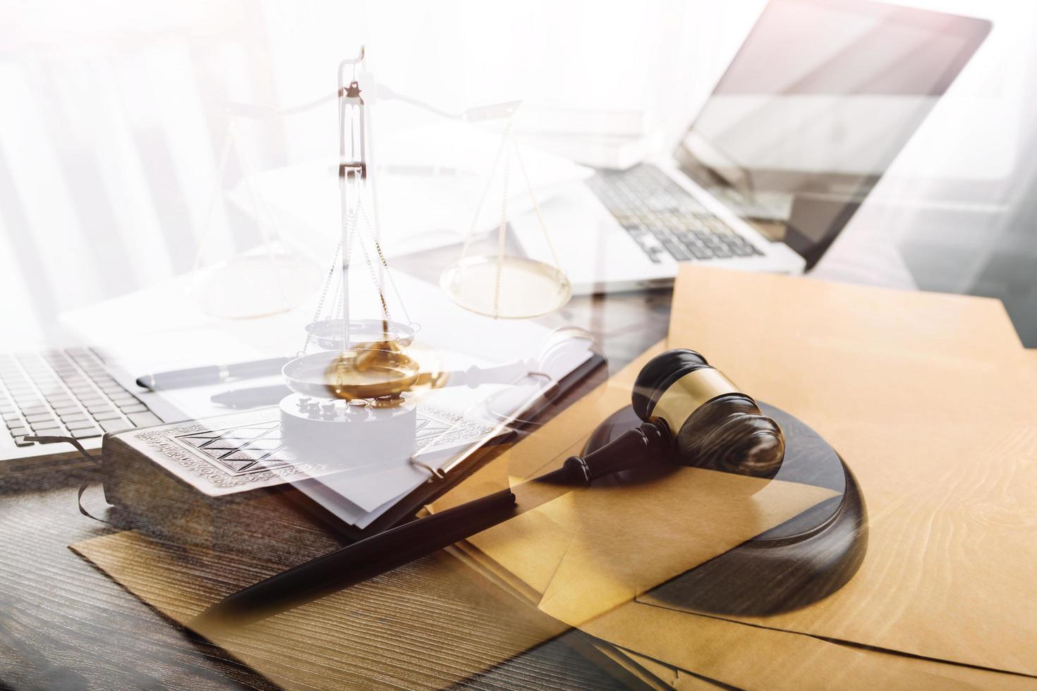 Business and lawyers discussing contract papers with brass scale on desk in office. Law, legal services, advice, justice and law concept picture with film grain effect photo