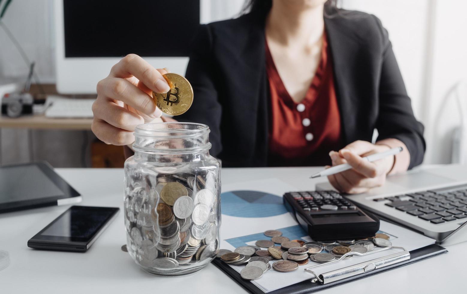 Business accounting concept, Business man using calculator with computer laptop, budget and loan paper in office. photo