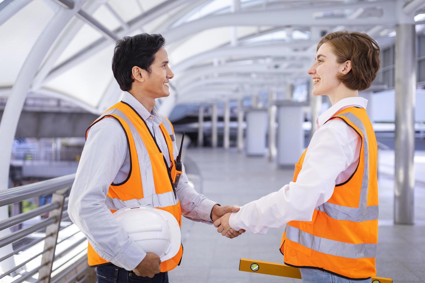 Team of diversity engineer is having handshake after done inspecting the construction project for modern architecture and real estate development concept photo
