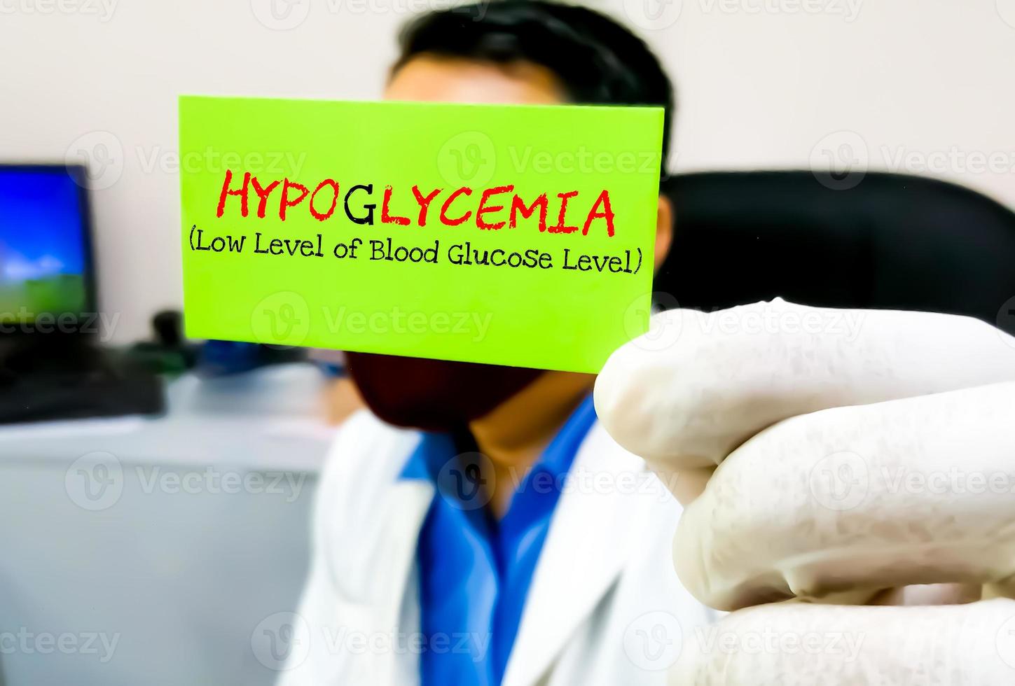 Hypoglycemia, medical term. Scientist hold card with text Hypoglycemia. Low blood sugar level. photo