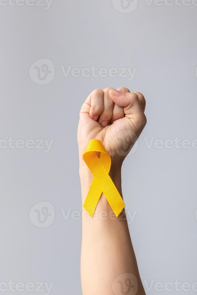 Suicide prevention day, Childhood, Sarcoma, bone and bladder cancer Awareness month, Yellow Ribbon for supporting people life and illness. children Healthcare and World cancer day concept photo