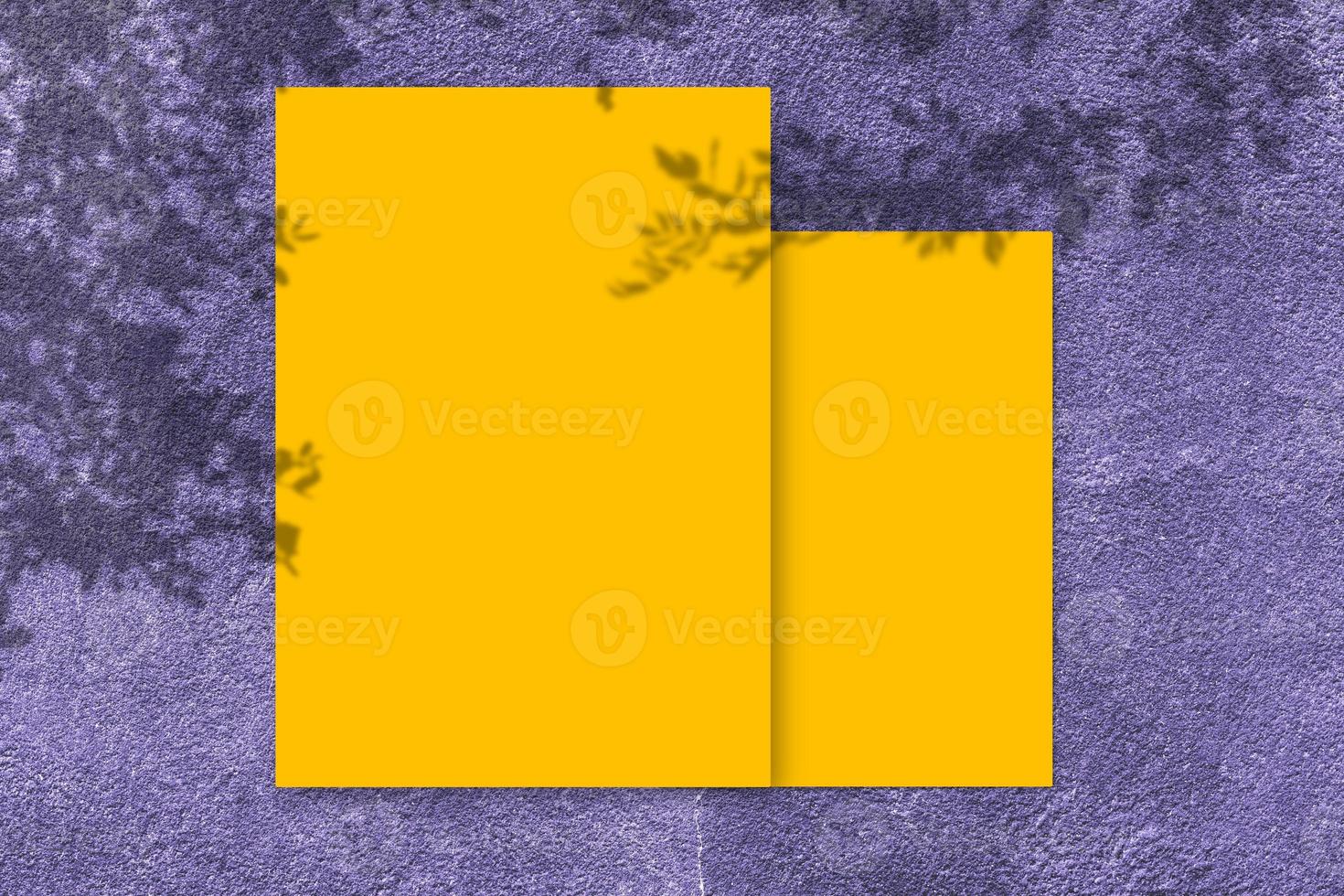 Empty yellow square poster mockup with light shadow on purple concrete wall background. photo
