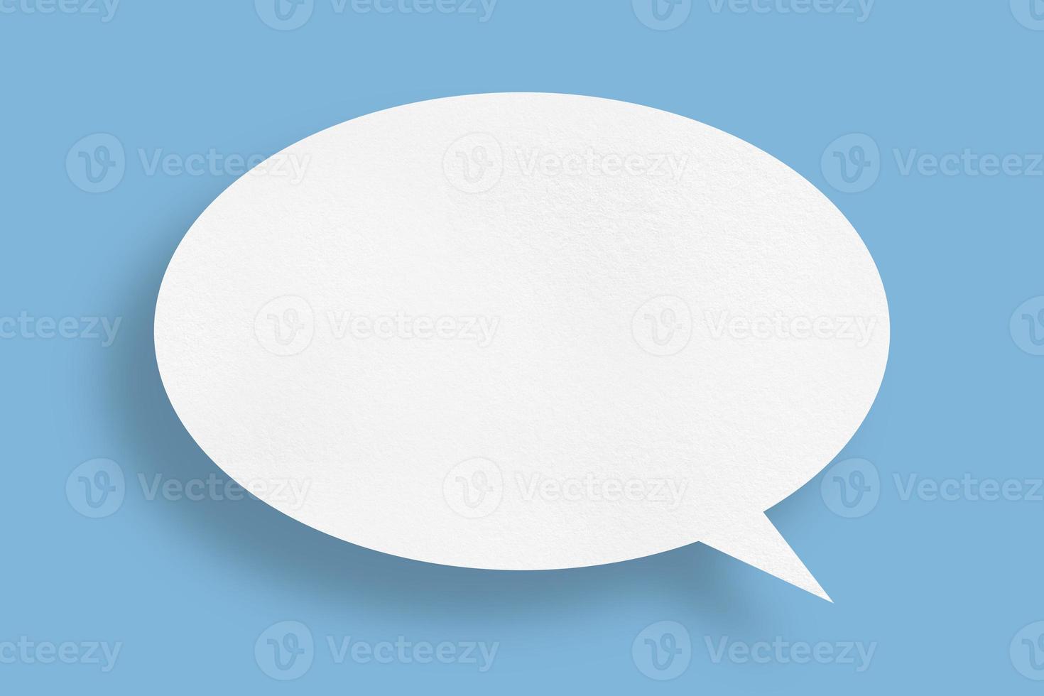 white paper with speech bubbles isolated on blue background communication bubbles photo