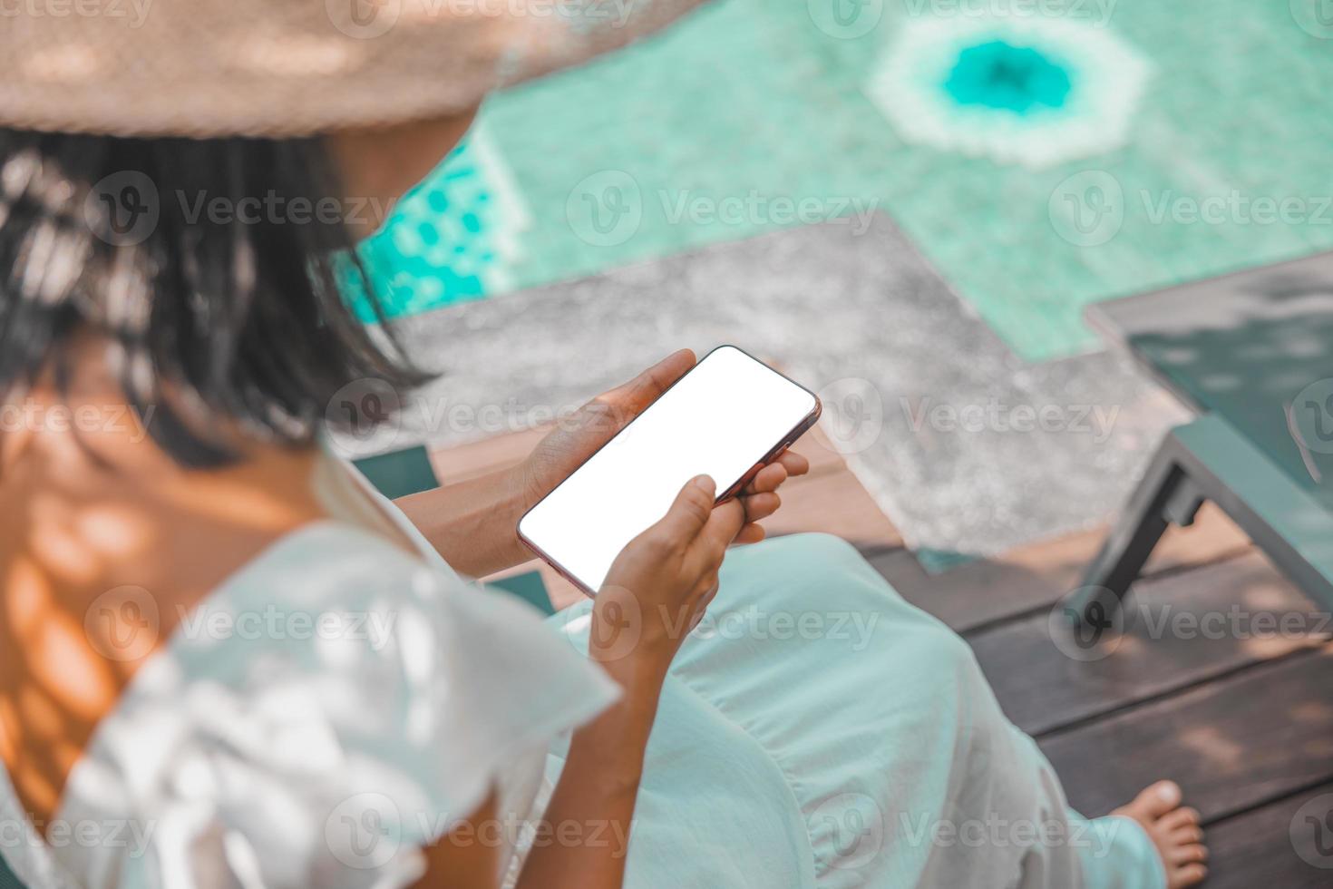 Close-up woman of Left hand held, right hand use finger touches with digital smartphone white screen isolated on white background. Concept of technology, connection, communication, social. photo