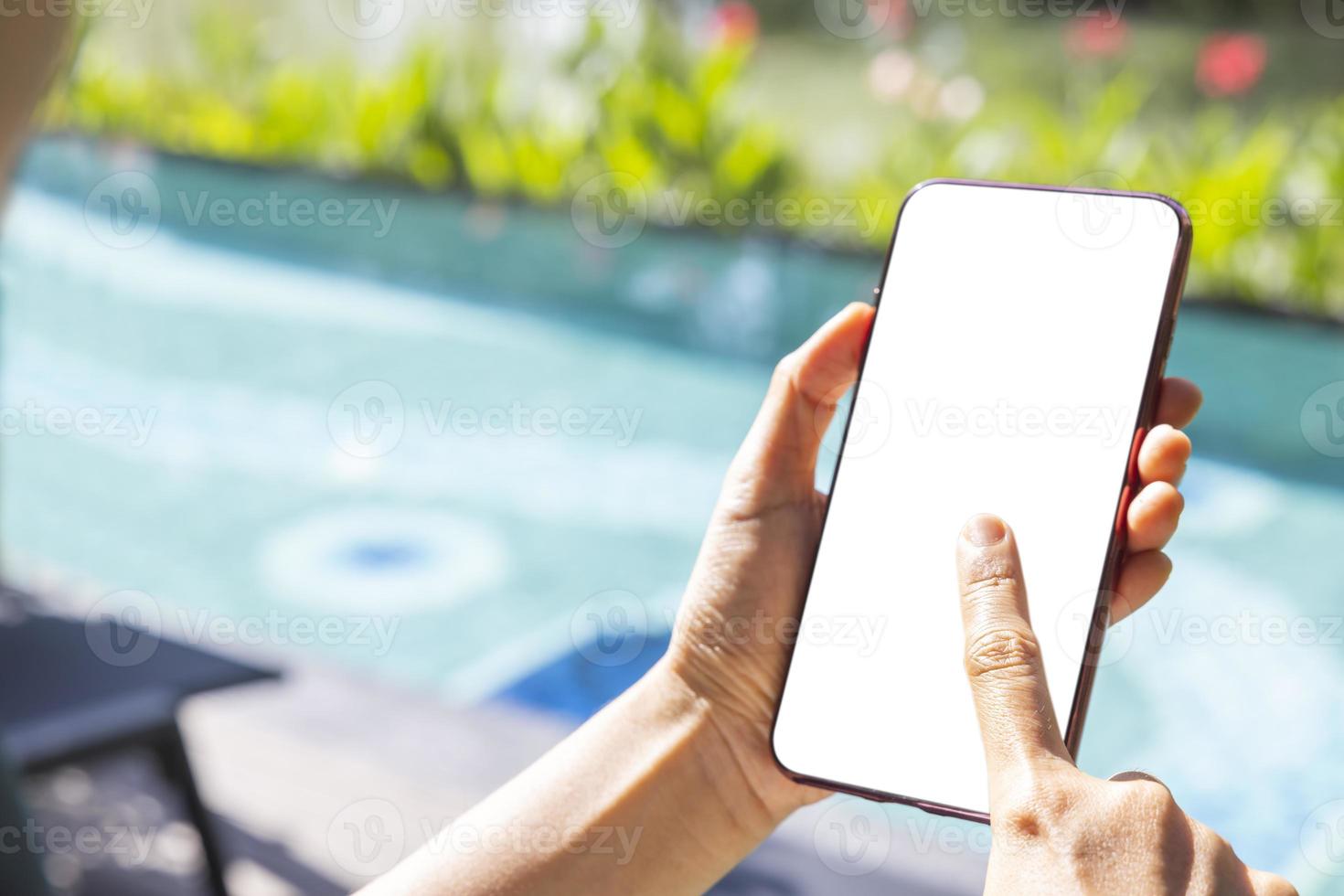 Close-up woman of Left hand held, right hand use finger touches with digital smartphone white screen isolated on white background. Concept of technology, connection, communication, social photo