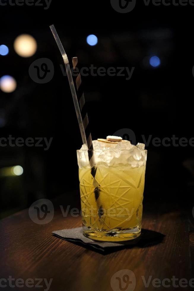 Beautiful cocktail in a glass with a dark background photo