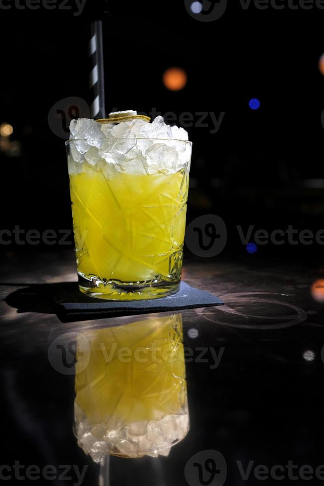 Beautiful cocktail in a glass with a dark background photo