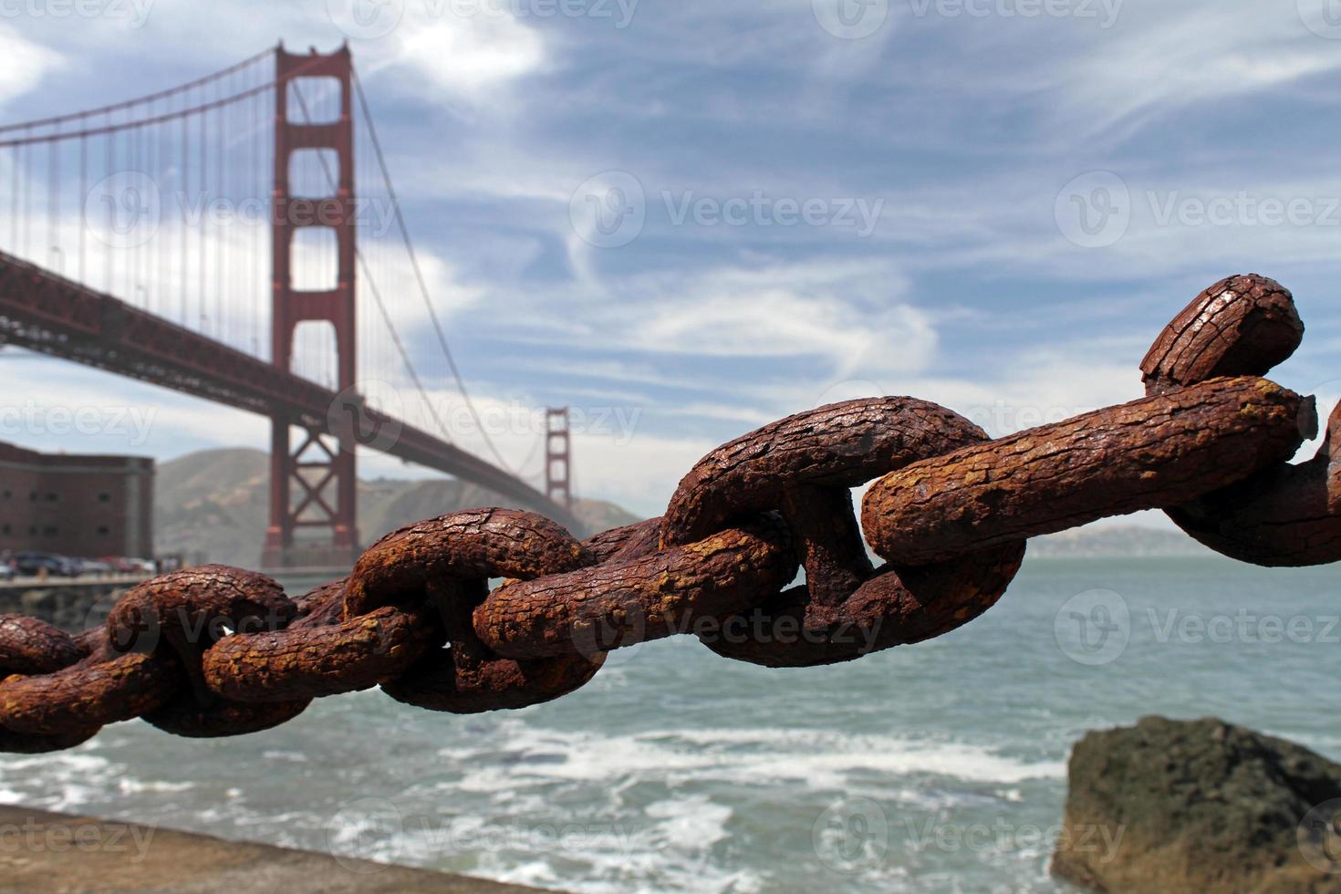 Rusty chain with Golden Gate Bridge in the background photo