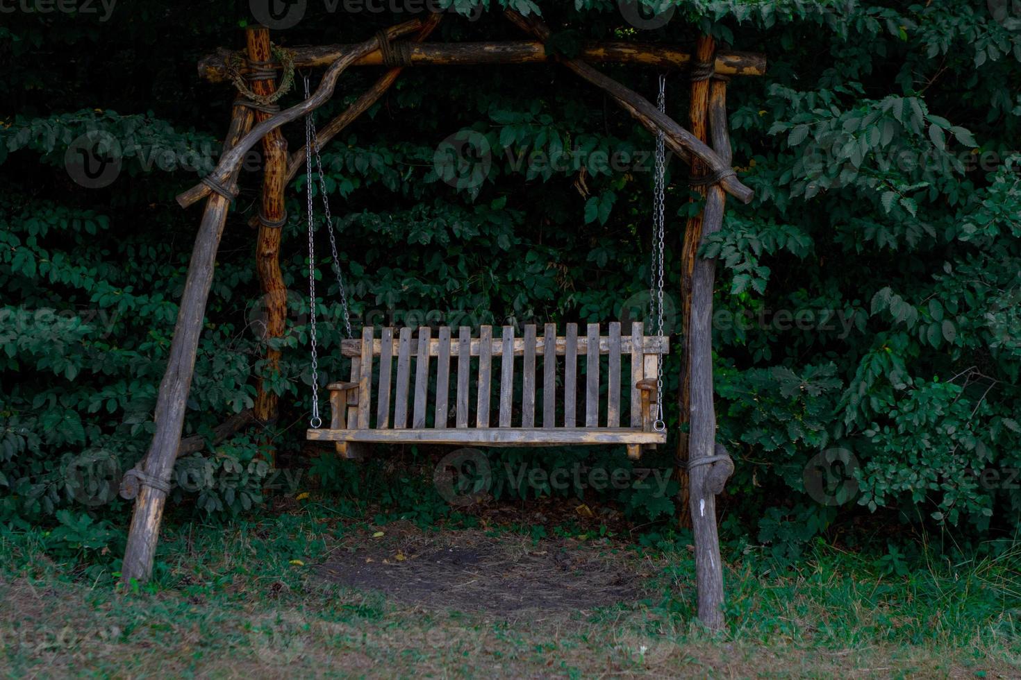 Garden swing in the forest photo