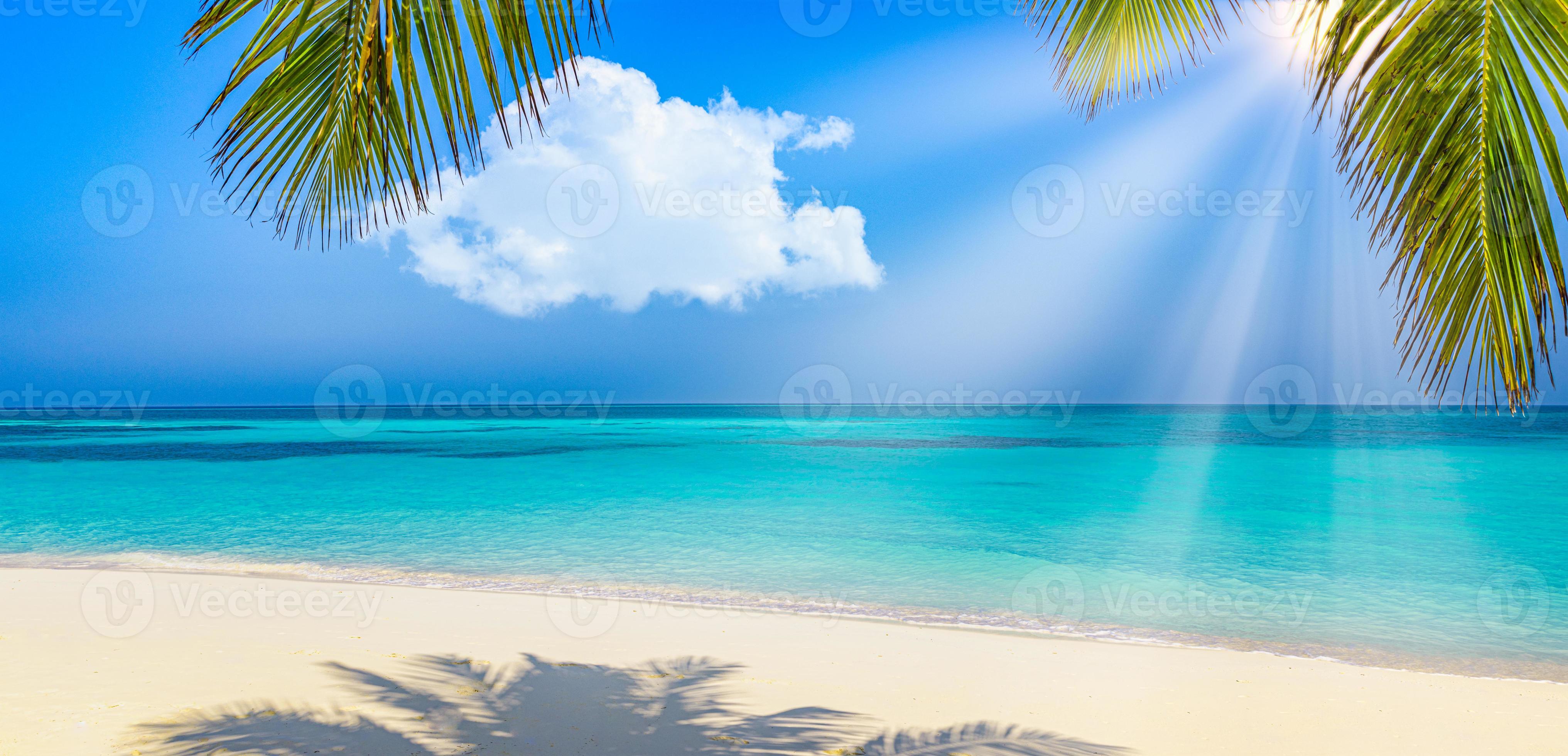 Panoramic landscape view of white beach sand sea water and blue sky