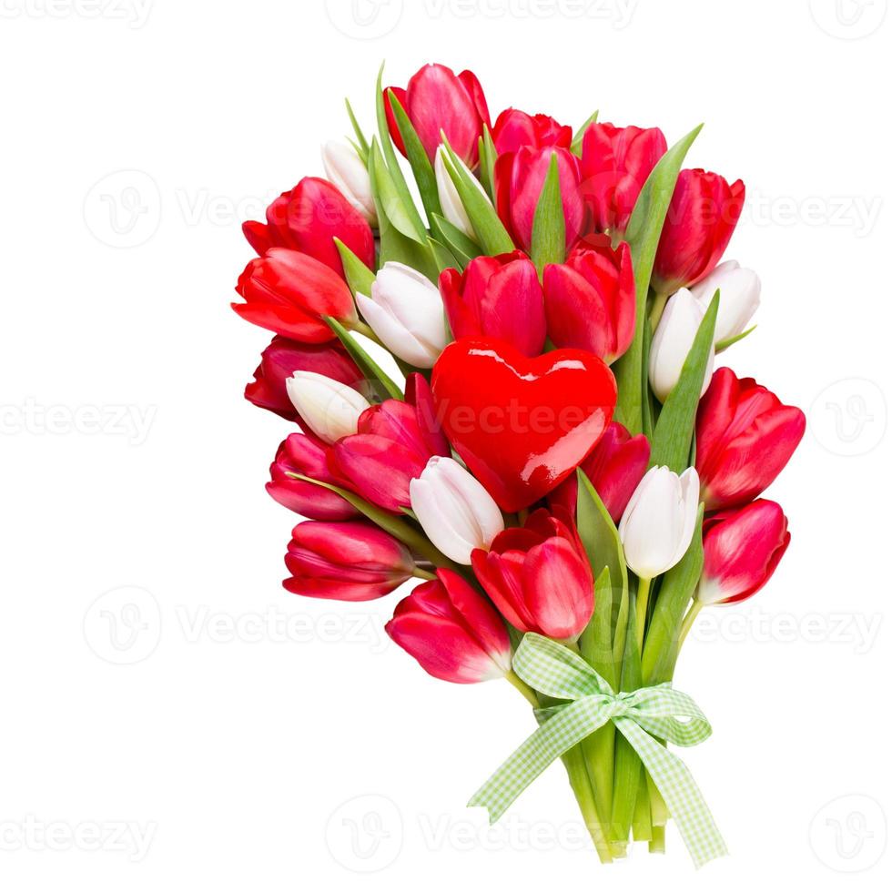 Springt time. Red tulip bouquet on the white wooden background. photo