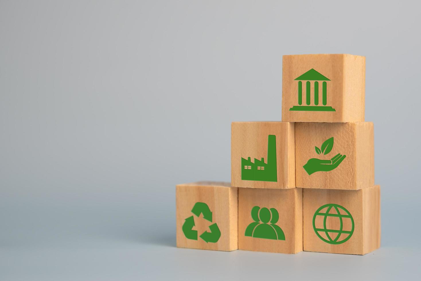 Wood cube block Esg Environmental Social and Governance eco concept of sustainable development of the organization.Investing and management of pollution to reduce global warming. photo