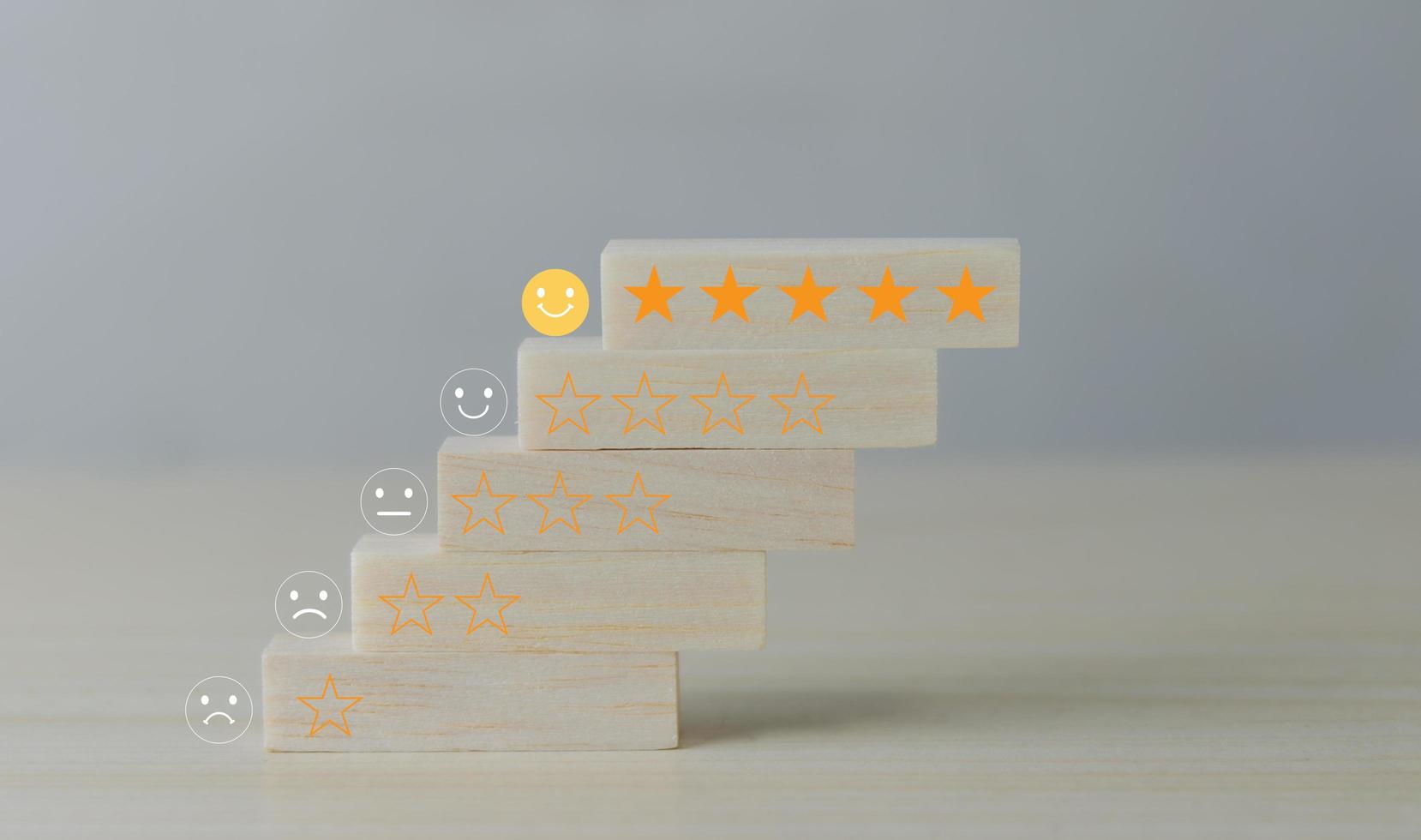 Customer service feedback 5 start wood cube block on table. photo