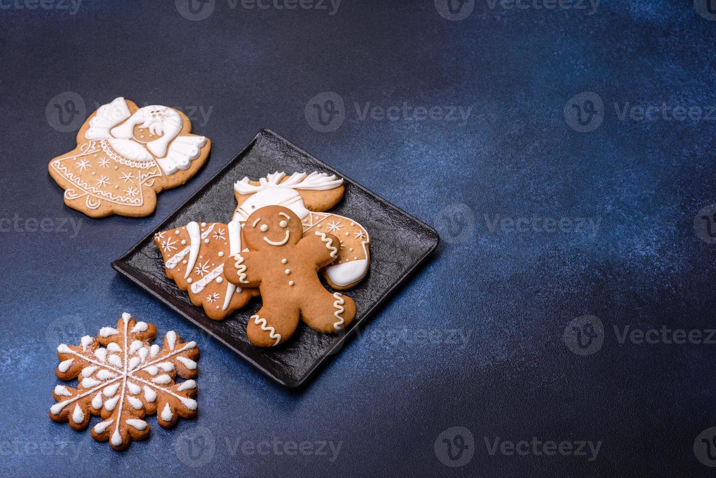Christmas decorations and gingerbreads on a dark concrete table. Getting ready to celebration photo