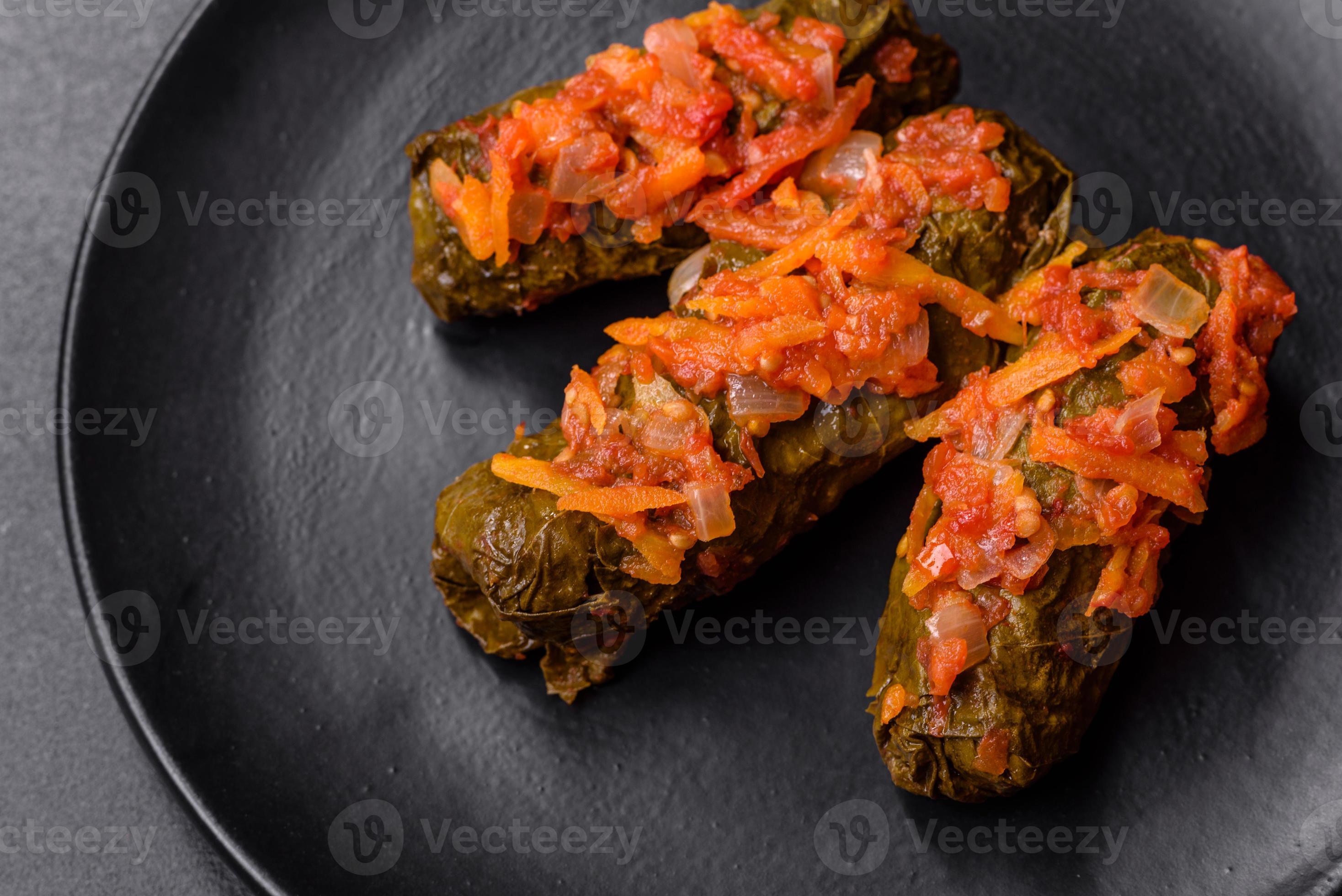 Dolma, stuffed grape leaves with rice and meat on a dark background 11110080 Stock Photo at Vecteezy