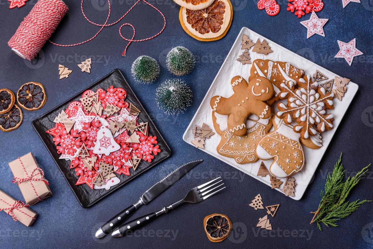 Christmas decorations and gingerbreads on a dark concrete table. Getting ready to celebration photo