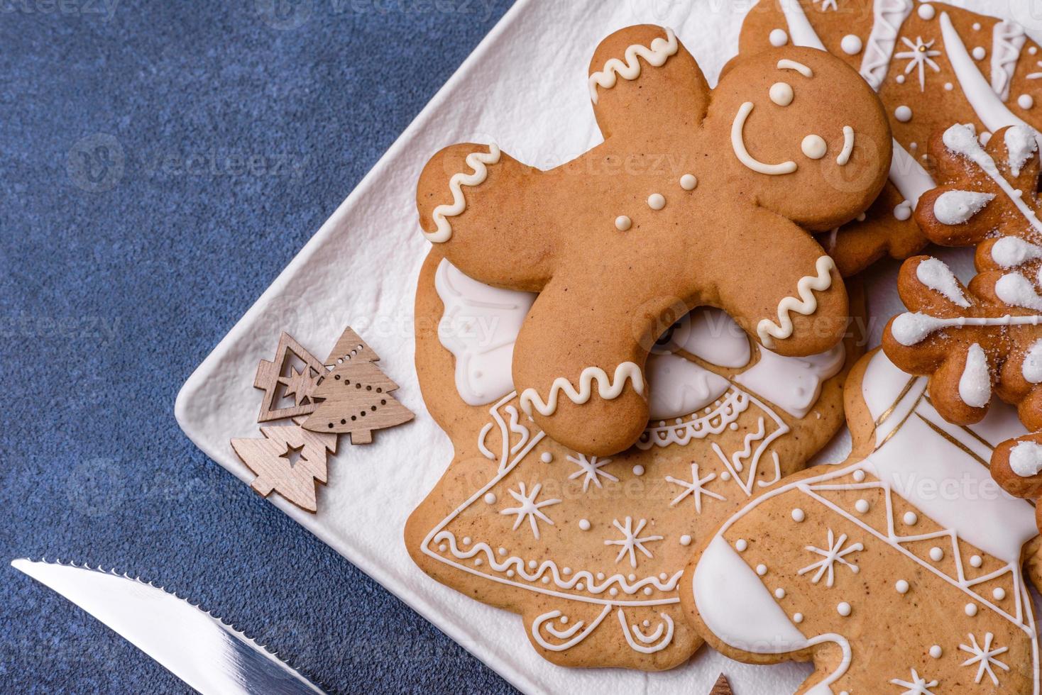 Christmas decorations and gingerbreads on a dark concrete table. Getting ready to celebration photo