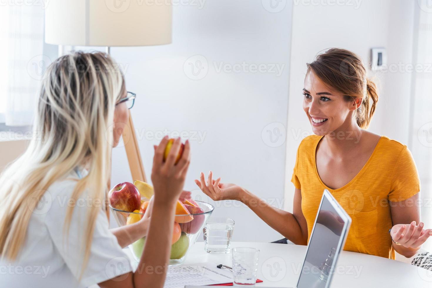 Doctor nutritionist, dietician and female patient on consultation in the office. Female nutritionist giving consultation to patient. Making diet plan. photo