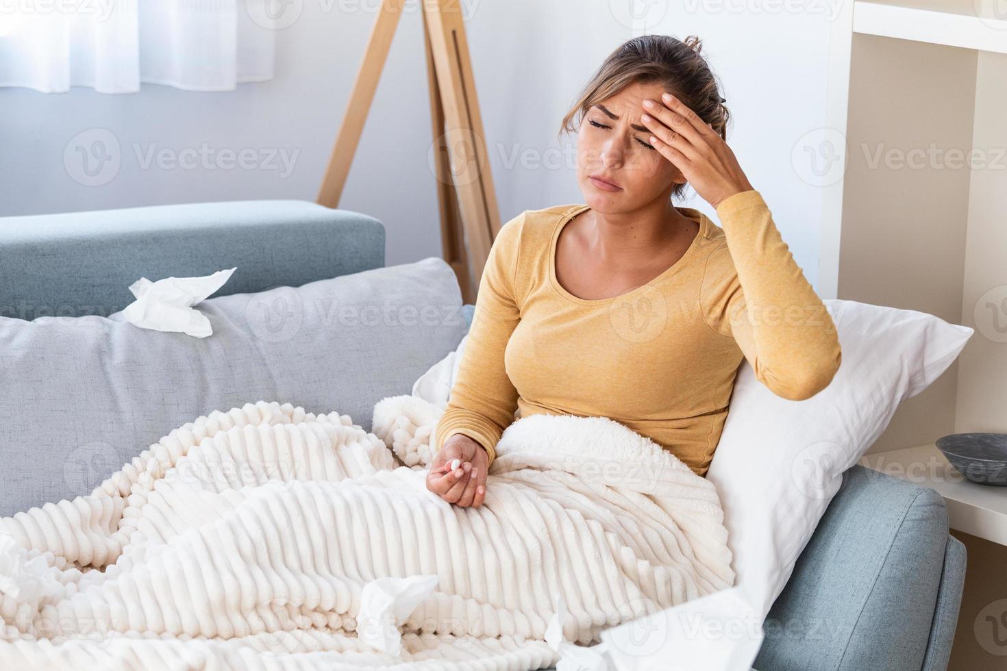 Sick desperate woman has flu. Rhinitis, cold, sickness, allergy concept. Pretty sick woman has runnning nose, rubs nose with handkerchief. Sneezing female. photo