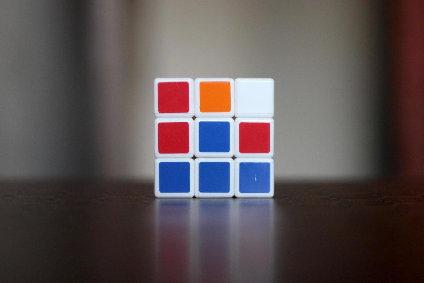 Rubik's cube on the black background. Rubik's Cube was invented by Hungarian architect Erno Rubik in 1974. photo