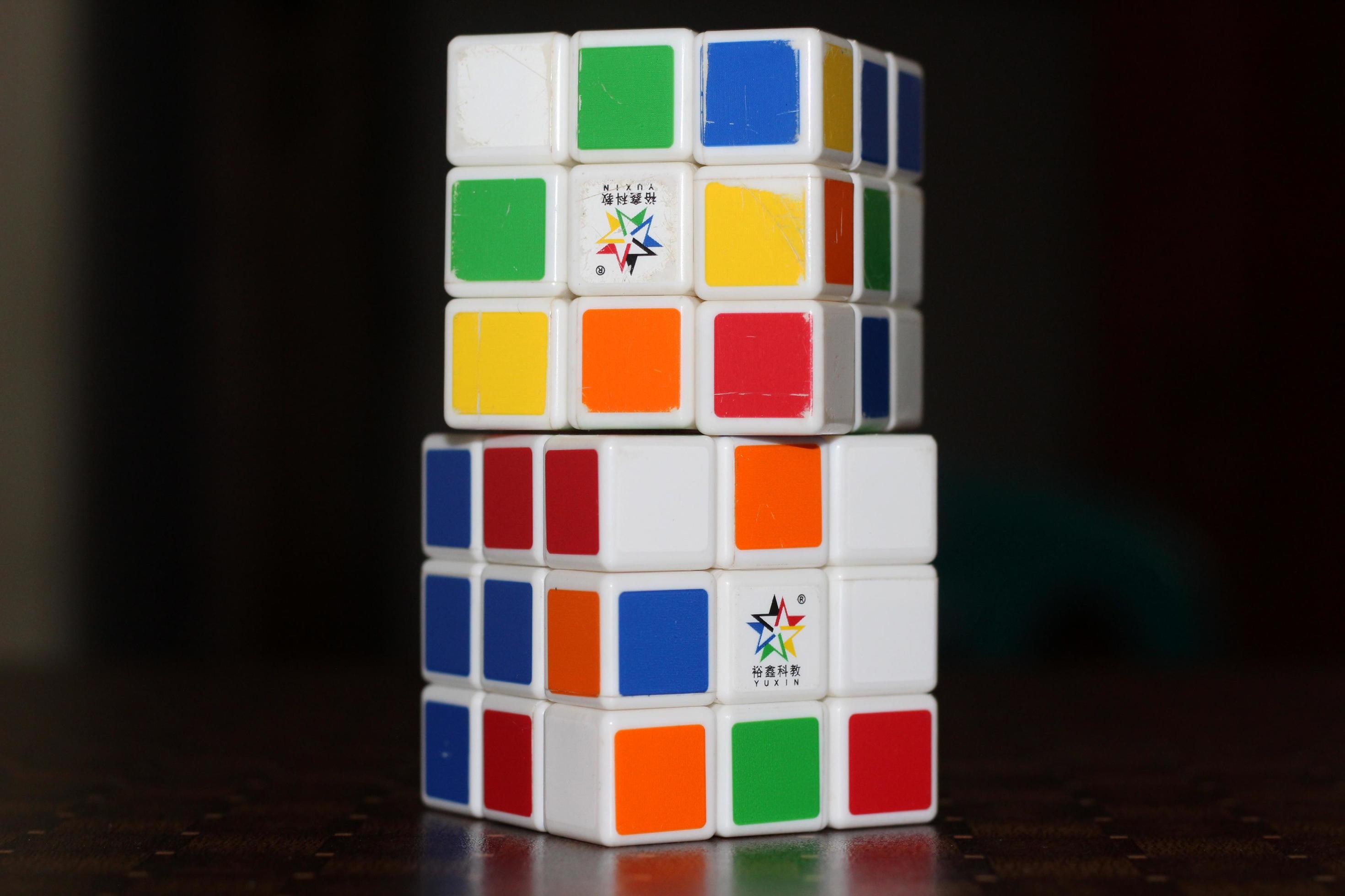 Rubik's cube on the black background. Rubik's Cube was invented by