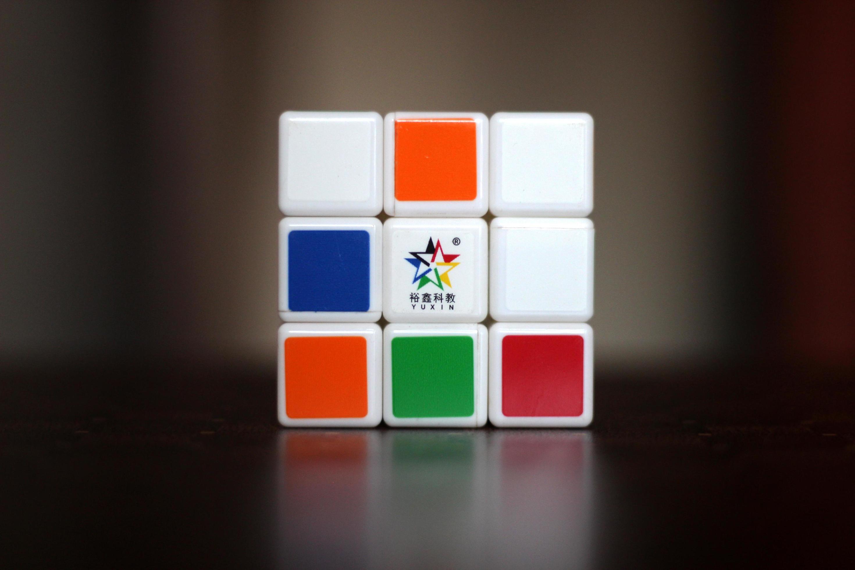 Rubik's cube on the black background. Rubik's Cube was invented by
