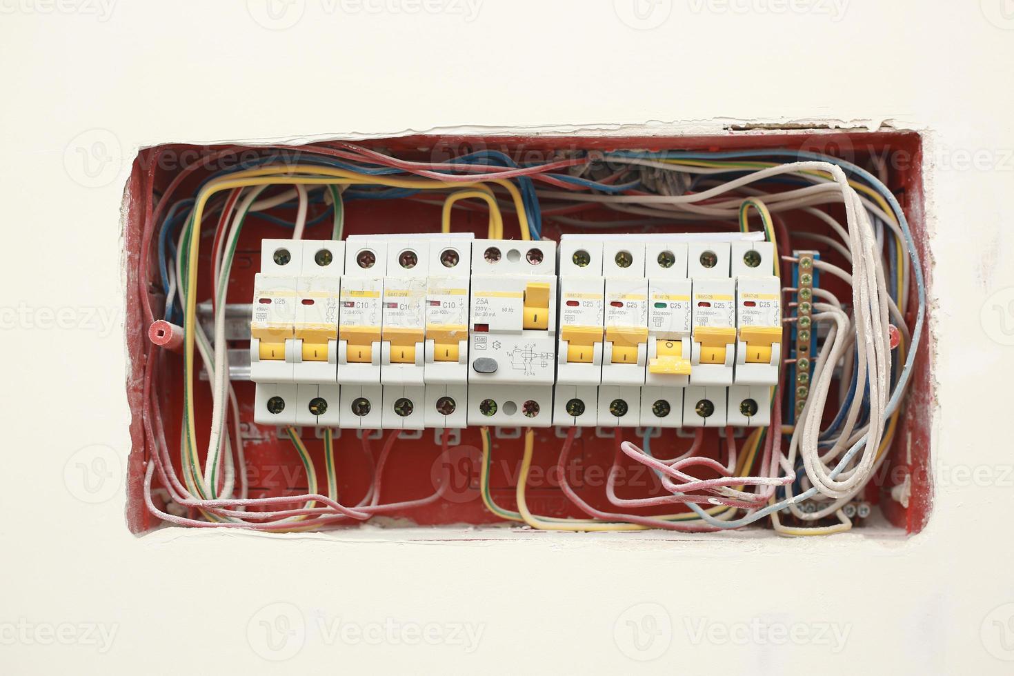 Electricity distribution box. Fuse Box. Isolated on white wall background. Electrical equipment. Background and texture photo