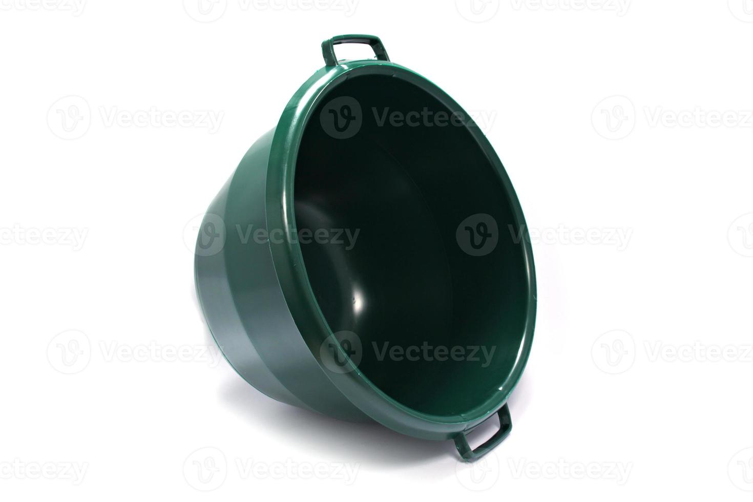 round plastic green washing up bowl isolated on white background. High quality photo