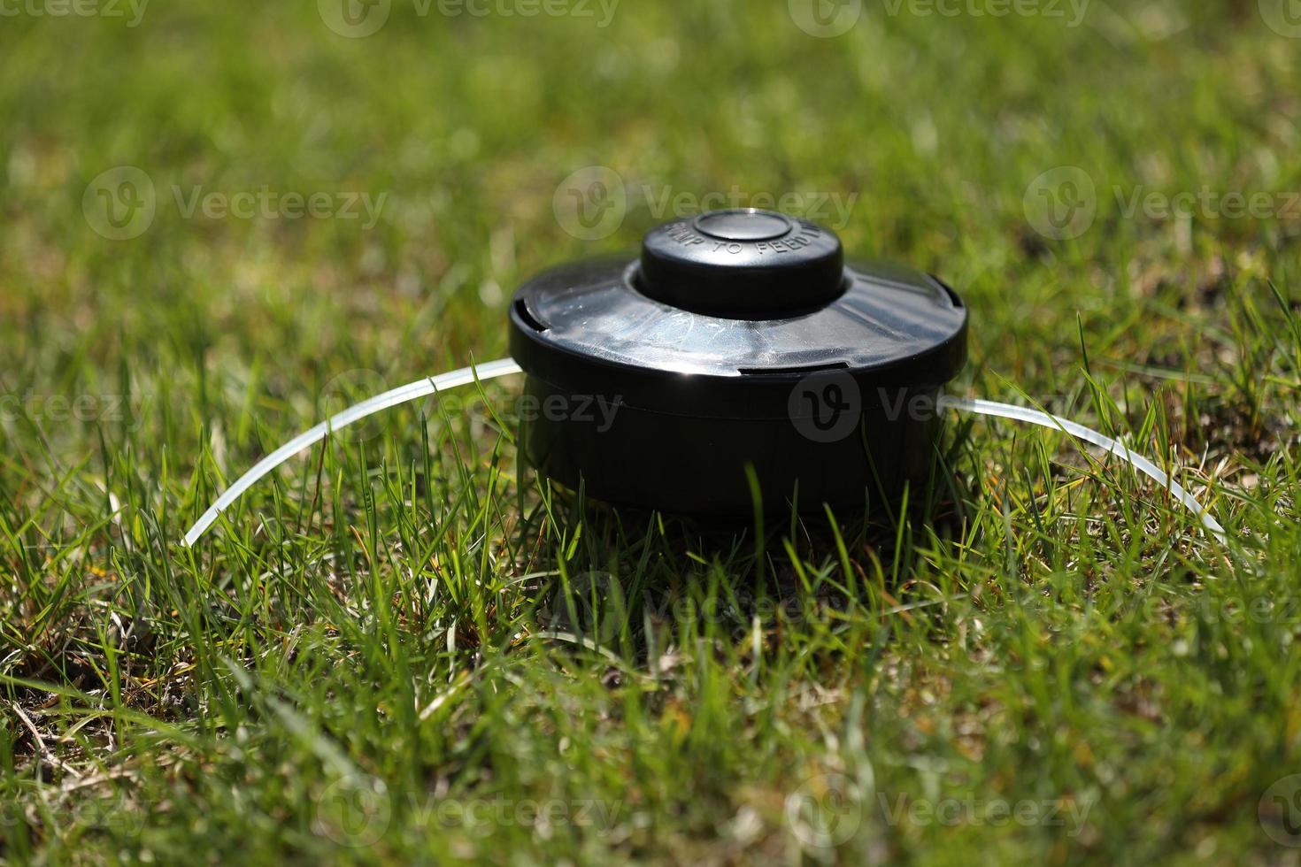automatic sprinkler system watering the lawn on a background of green grass, close up photo