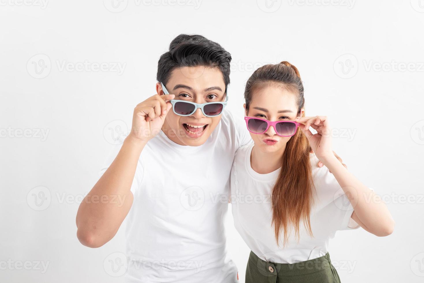 Close up photo of astonished spouses touching their eyewear eyeglasses wearing glasses eyewear isolated over white background