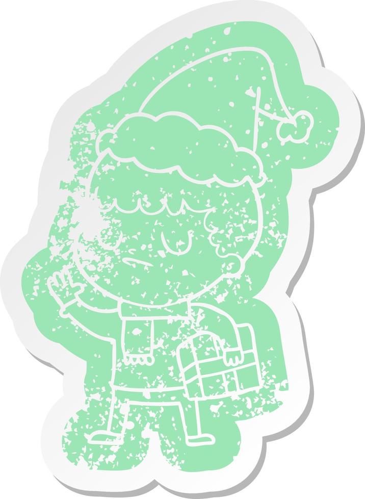 cartoon distressed sticker of a grumpy boy wearing santa hat vector