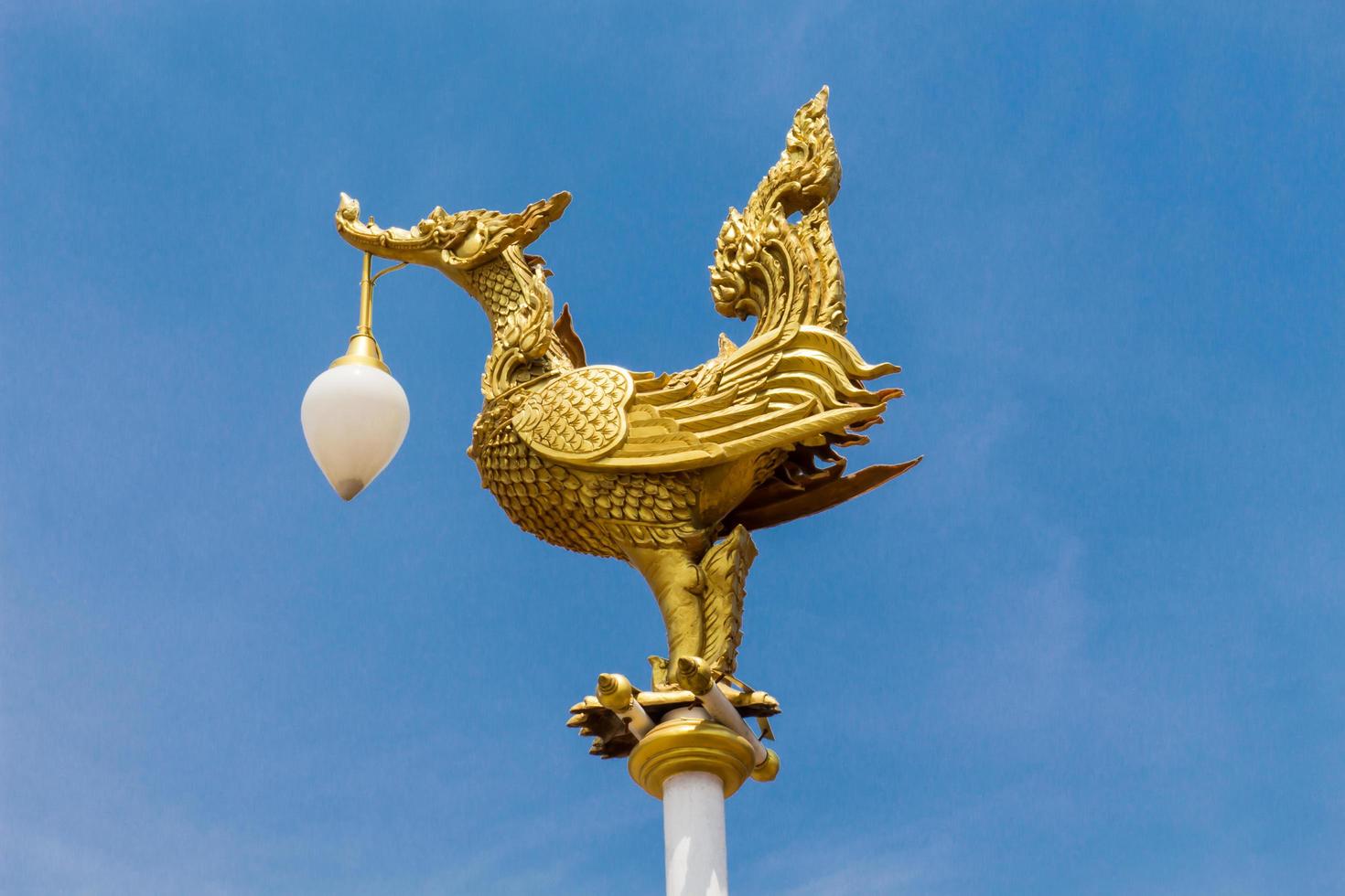 Street lamp with a figure of a bird photo