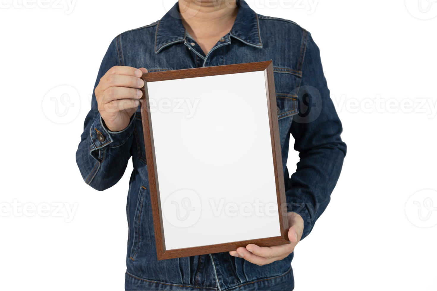 A blank diploma or a mockup certificate in the hand of a male person wearing a denim shirt on a gradient gray background with a clipping path. The picture frame is empty and the copy space. png