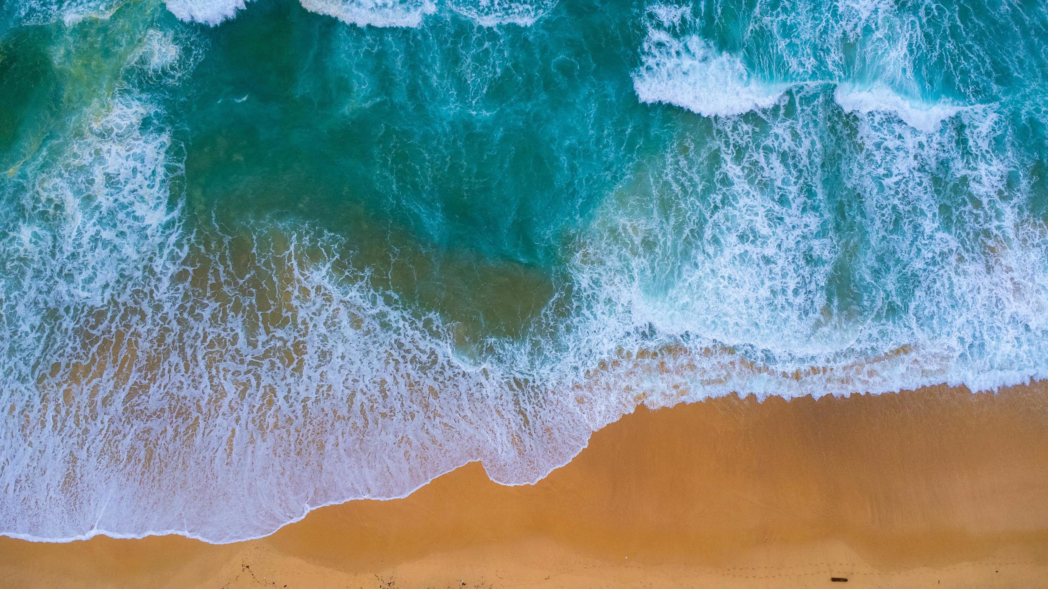 Beautiful sea waves and white sand beach in the tropical island ...