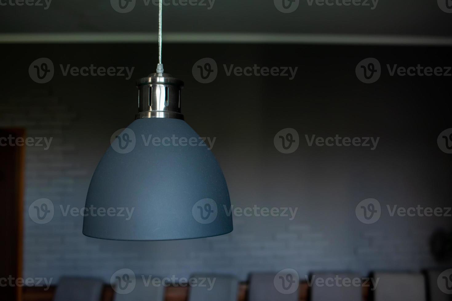 Close up of black stylish lamp hang over billiard table. Leisure activity interior design elements. selective focus photo