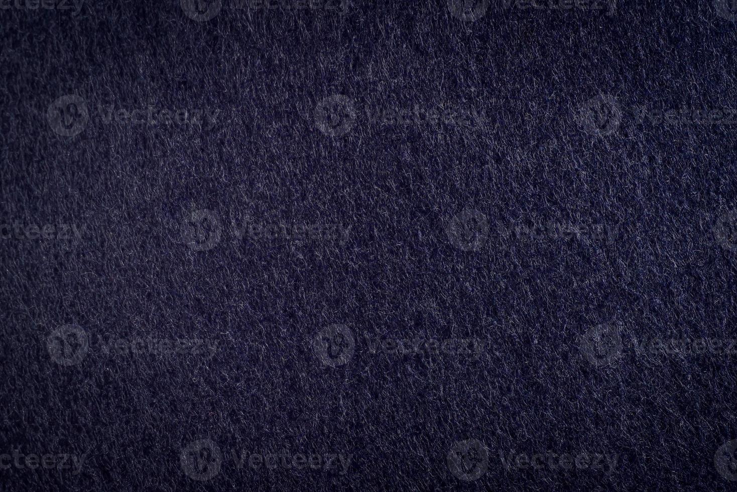 Close-up Texture of Dark blue velvet paper , dark blue suede or navy blue fabric, nubuck textile, background wallpaper photo