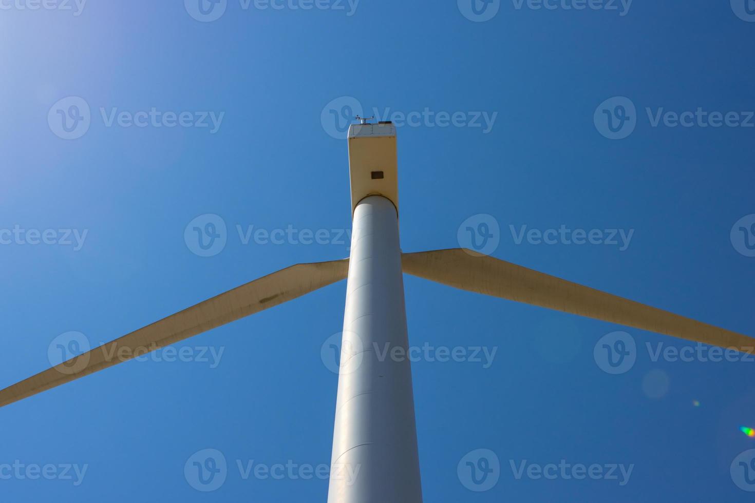 Wind farm, Wind farms. Wind power is the use of air flow through wind turbines to mechanically Power generators for electric power. photo