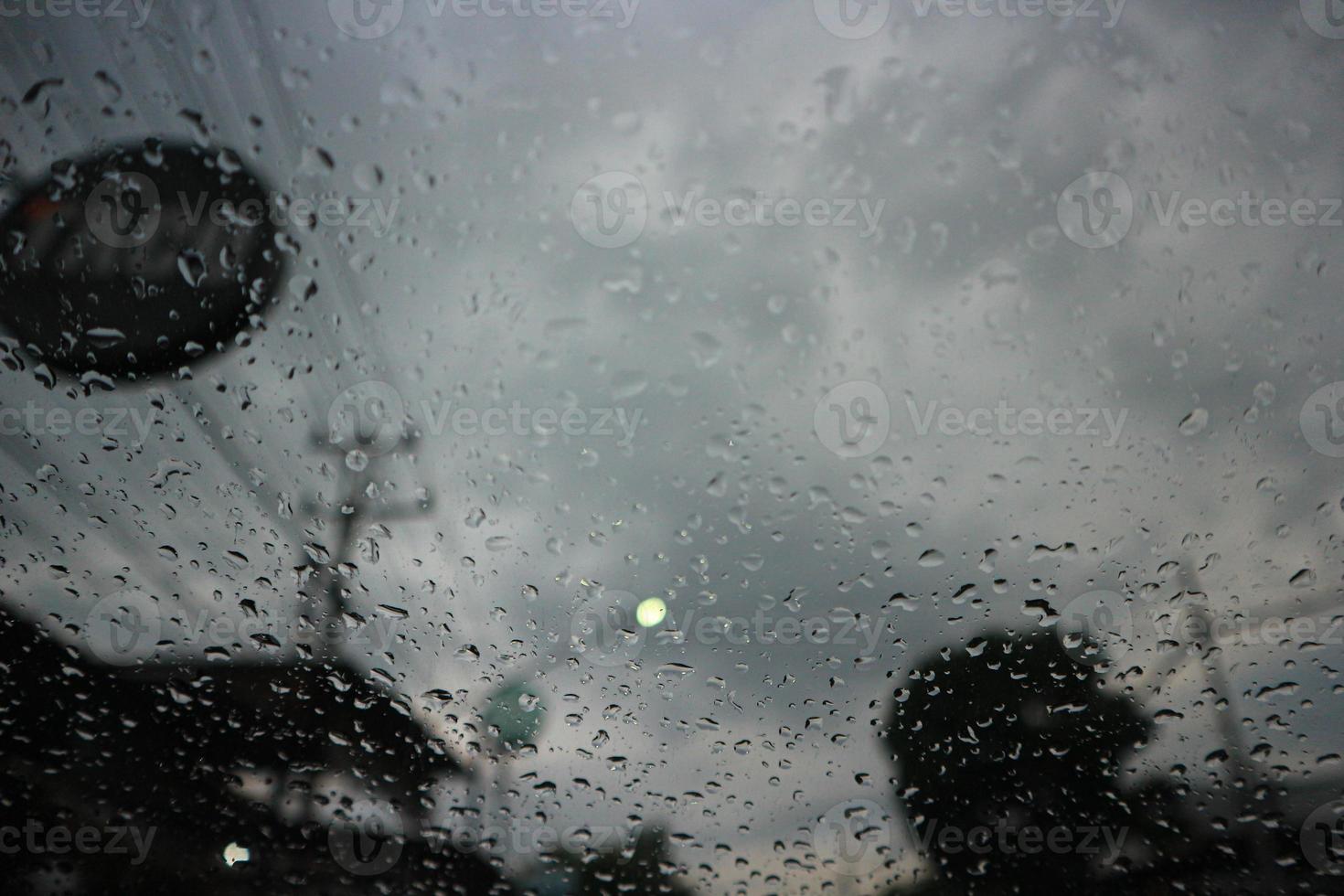 Blurred image of a raindrops on the windshield. photo