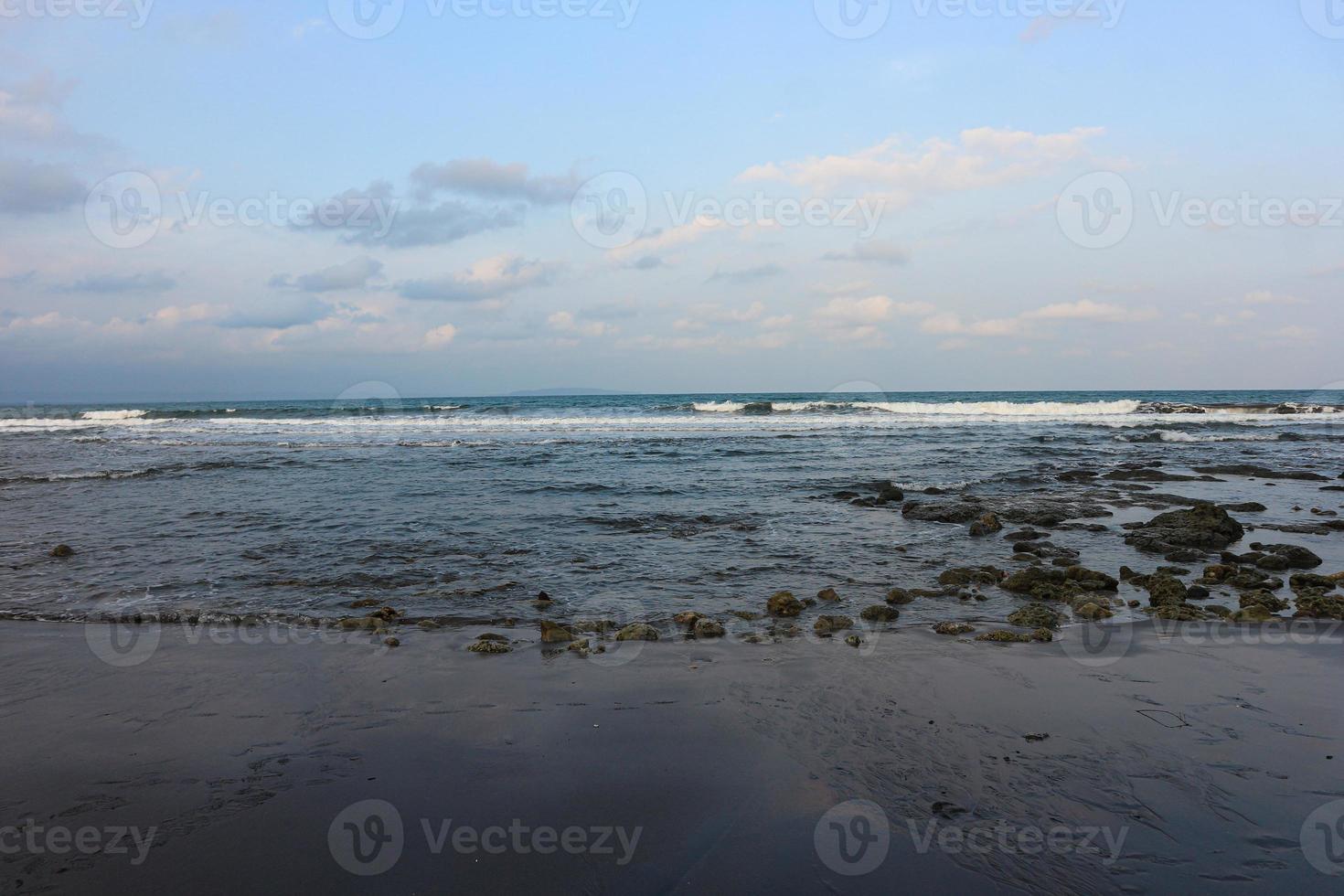 Sea Ocean Wave hit the rock at beach. Seascape. Focus on foreground photo