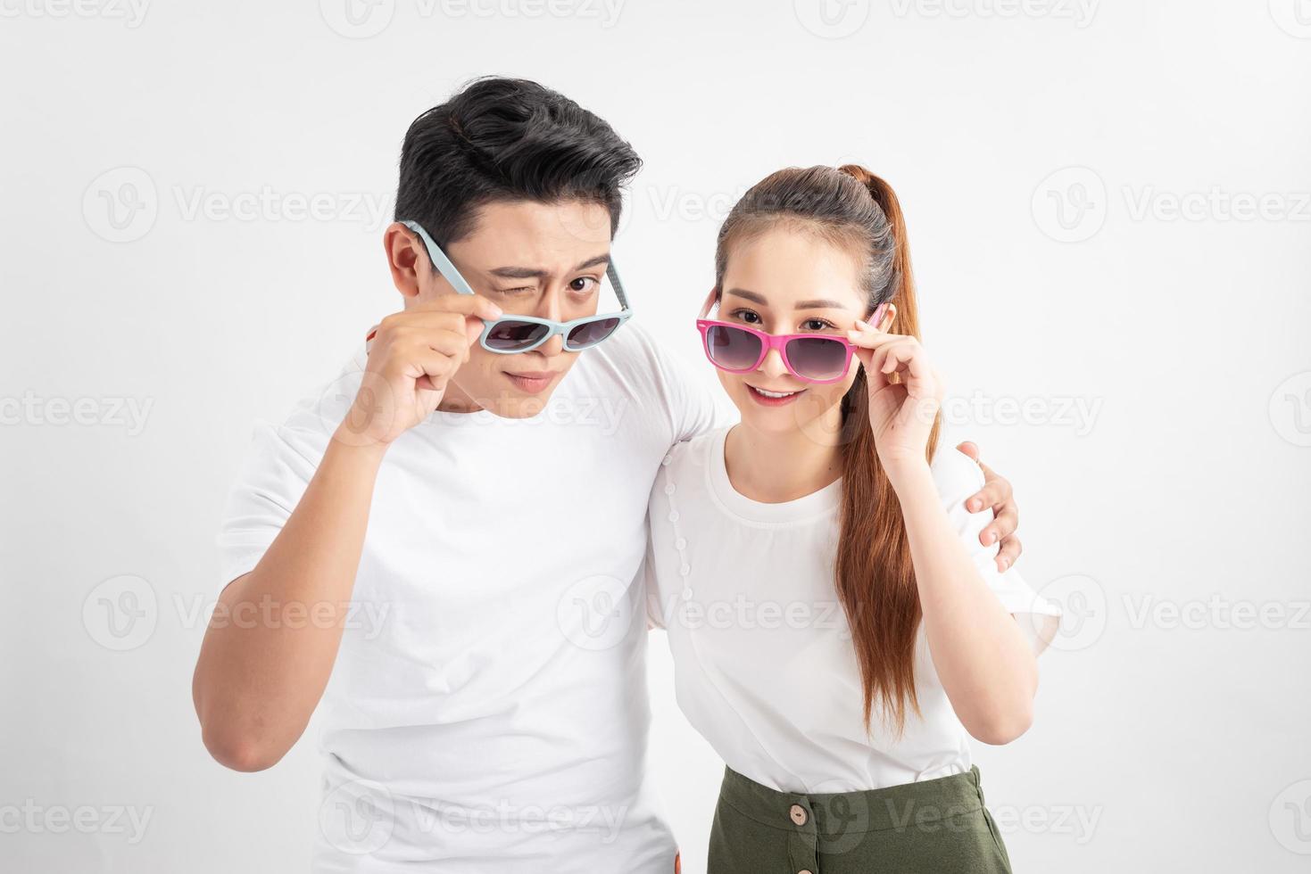 Cheerful happy family in glasses embracing and having vacation photo